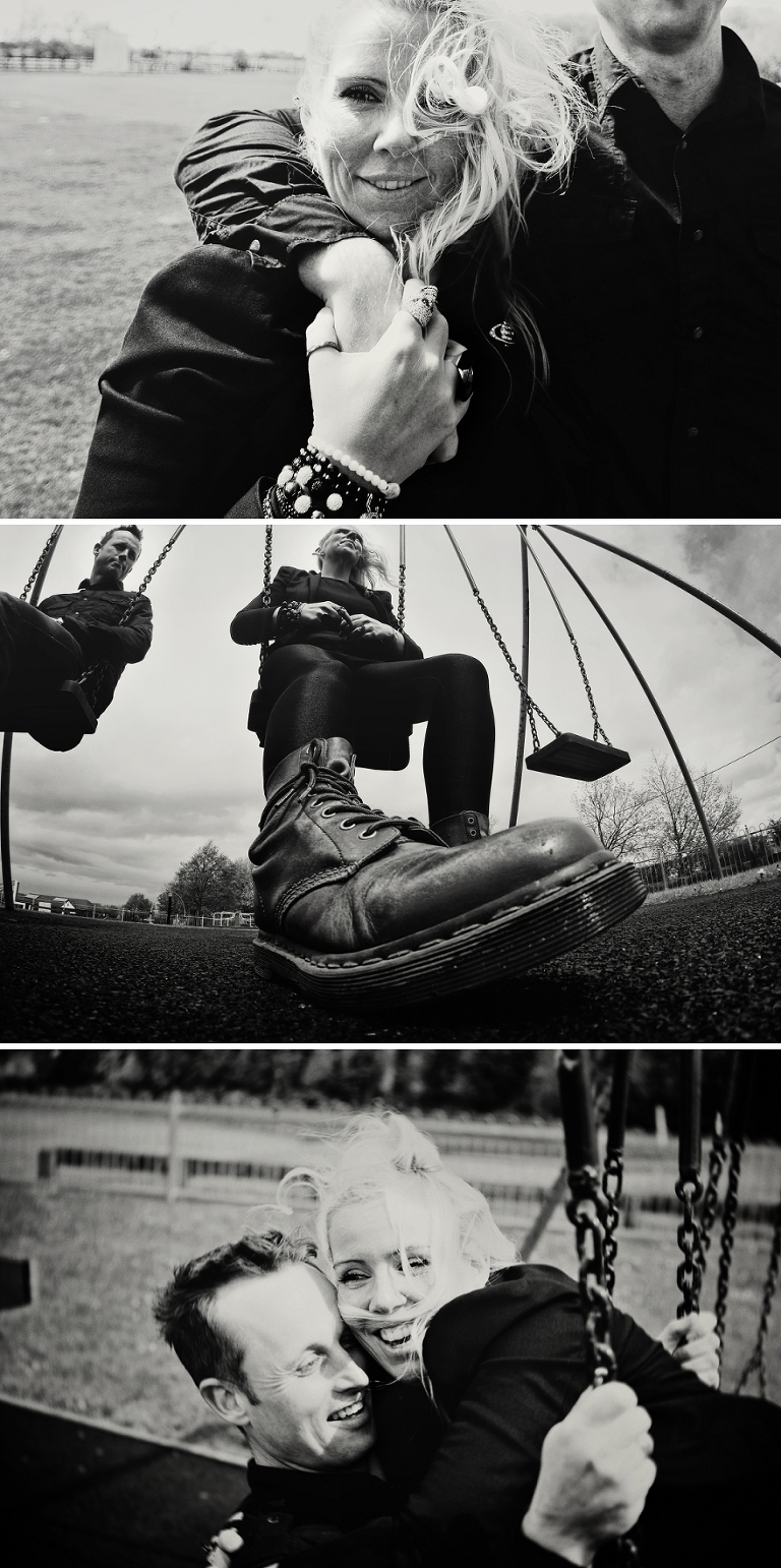Couple playing on swings wearing doc martens