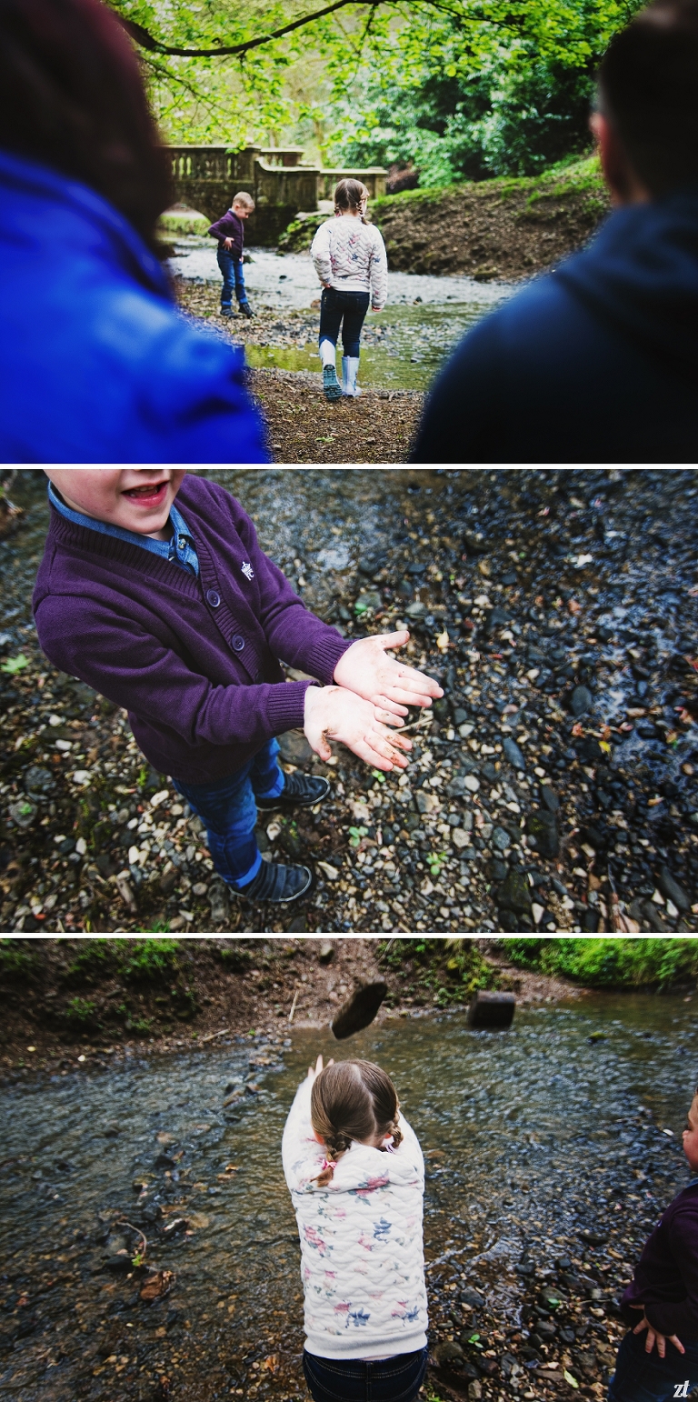 Children throwing stones into the water in Lancashire