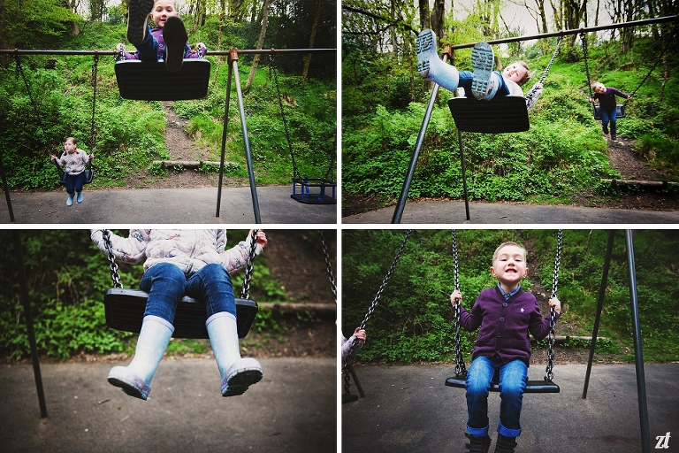 Brother and sister playing on the swings in a park in Blackburn Lancashire