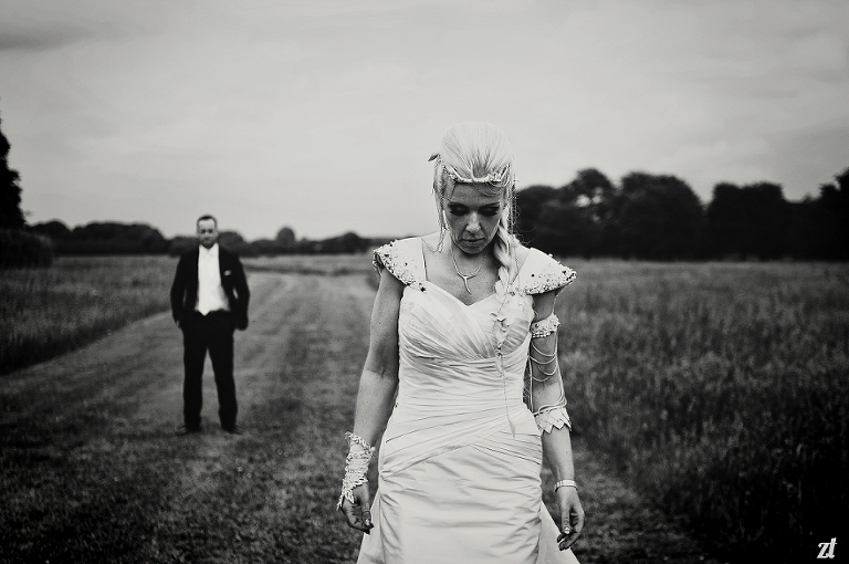 Bride in foreground in a field at Meols Hall in Southport