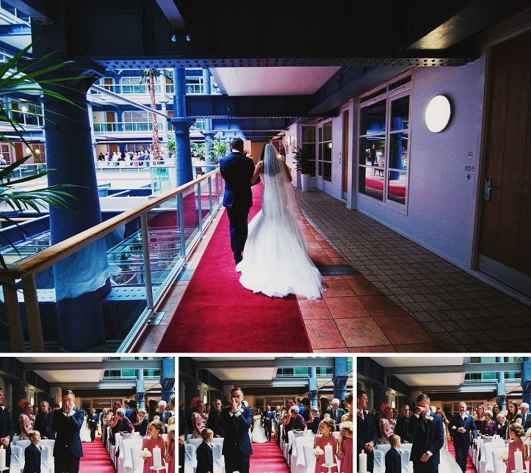 Bride walking down aisle at The Place Hotel in Manchester city wedding