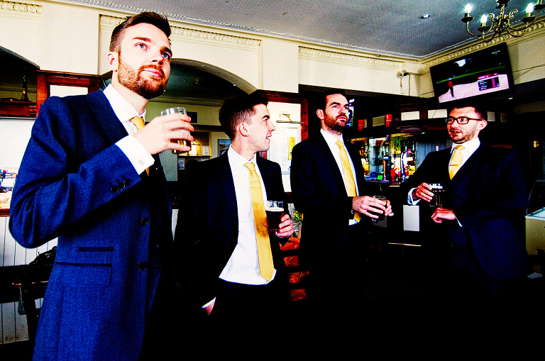 Groom and best men drinking half lagers in a milnthorpe pub.