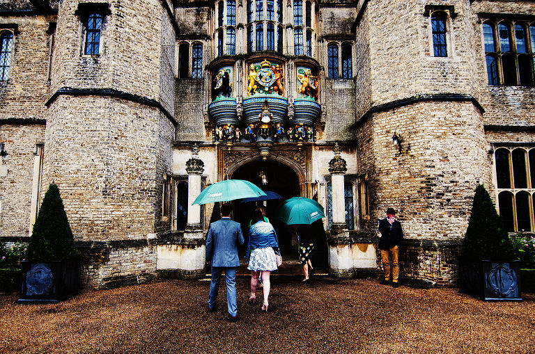 Hengrave Hall and guests caught in a rainy shower.