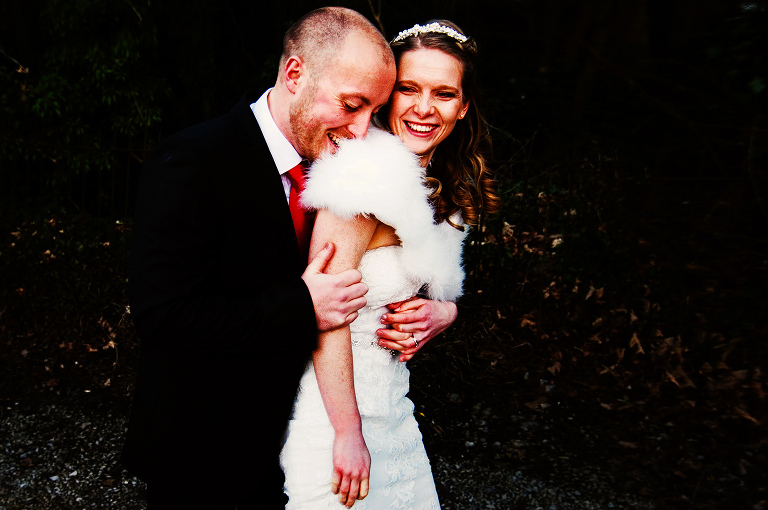 Bride and groom laughing together at singleton lodge.