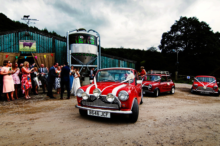 Red mini cars at a whitebottom farm wedding.