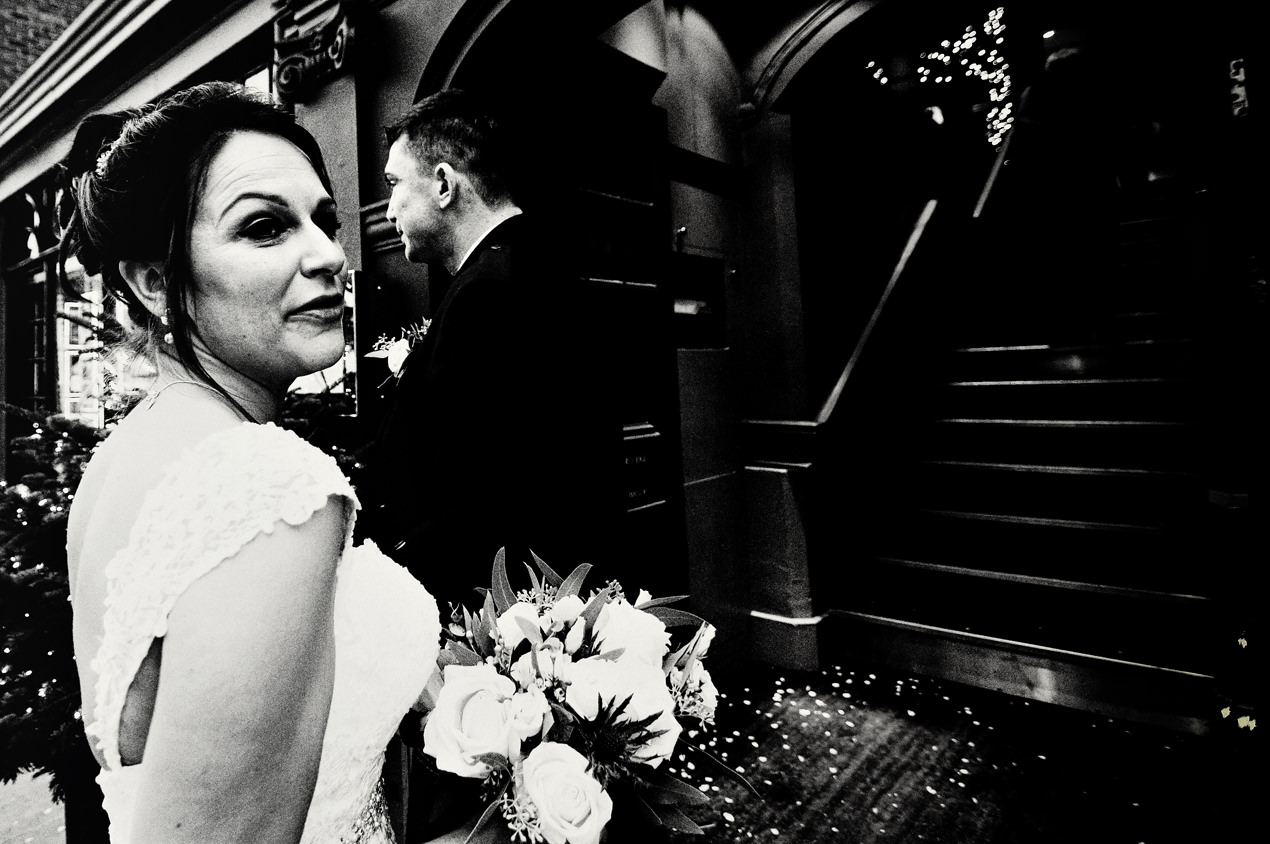 Oddfellows Wedding Photography of a bride outside on the High Street in Chester.