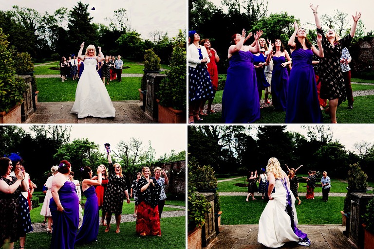 A happy purple wedding with the bride throwing her bouquet towards friends and family.