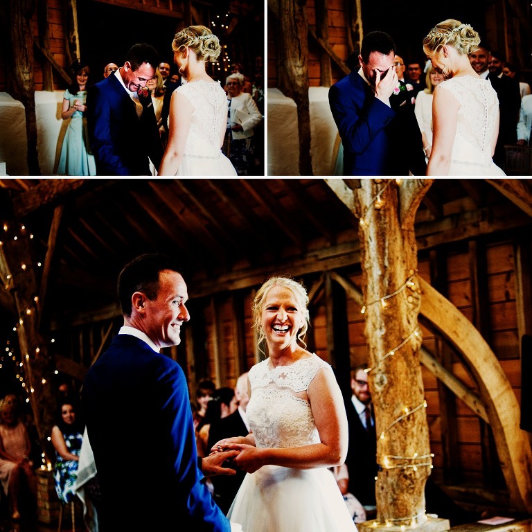 Emotional bride and groom inside the rickety barn at bassmead manor barns