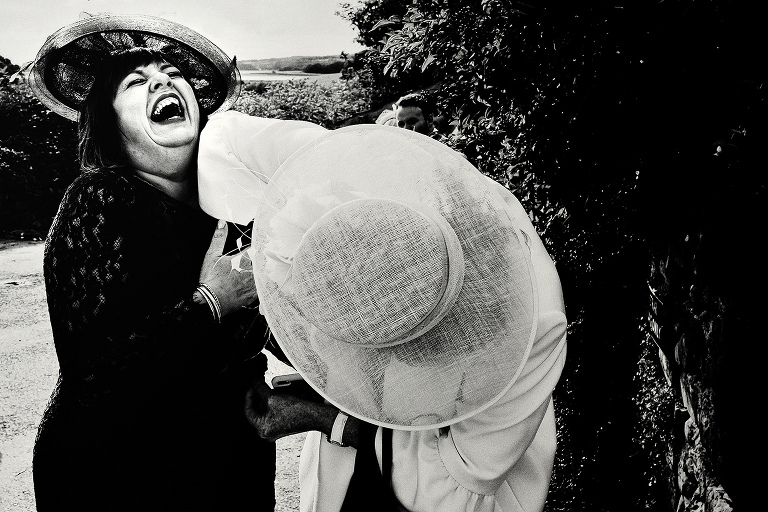 Bride mother with friend laughing.