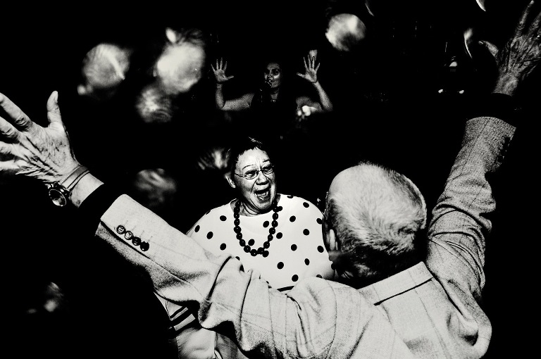 Dancing with arms in the air at a wedding at Eleven Didsbury House.