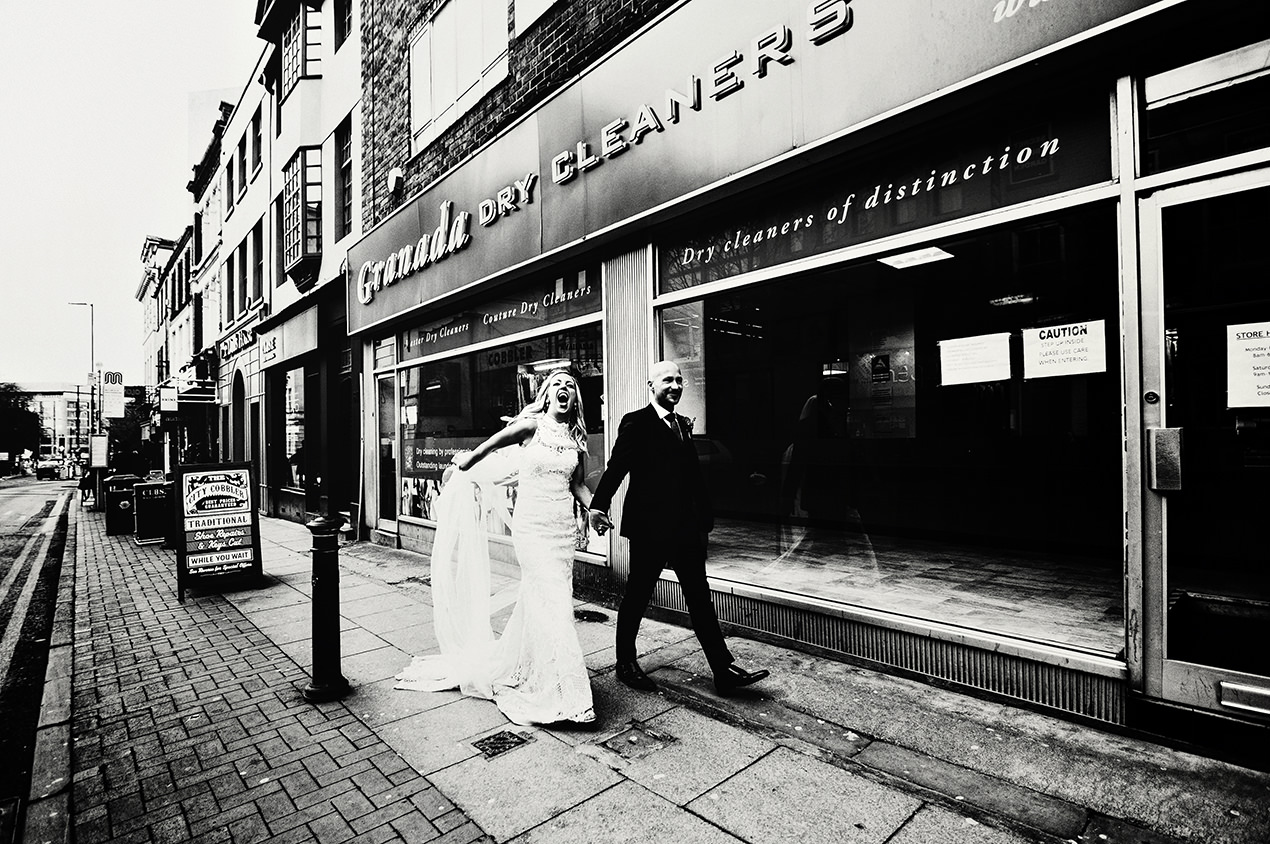 Black and white photo of a bride and groom and their Manchester Hall wedding photography
