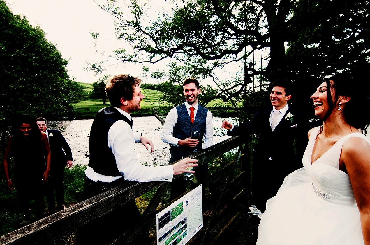 Unposed relaxed wedding photography by the the river hodder at the inn at whitewell.