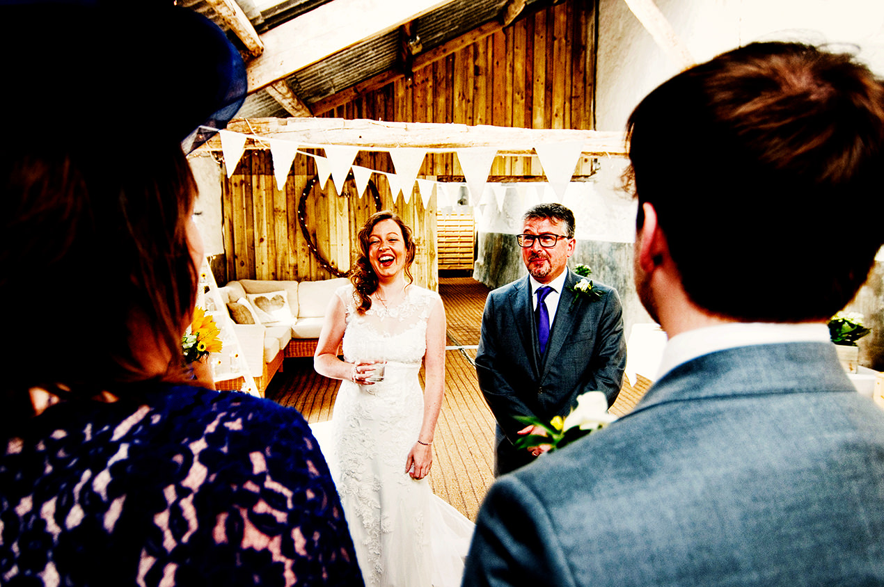 Bride and Dad inside park house barn wedding venue in cumbria.