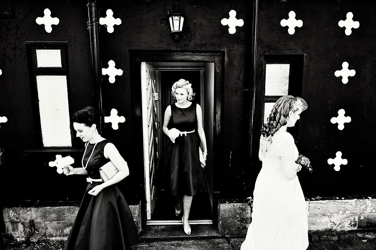 Bride and her bridesmaids walking from The Gatehouse to Samlesbury Hall.