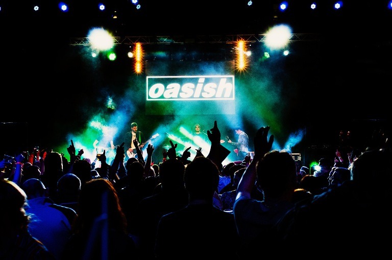 Oasish performing live on stage