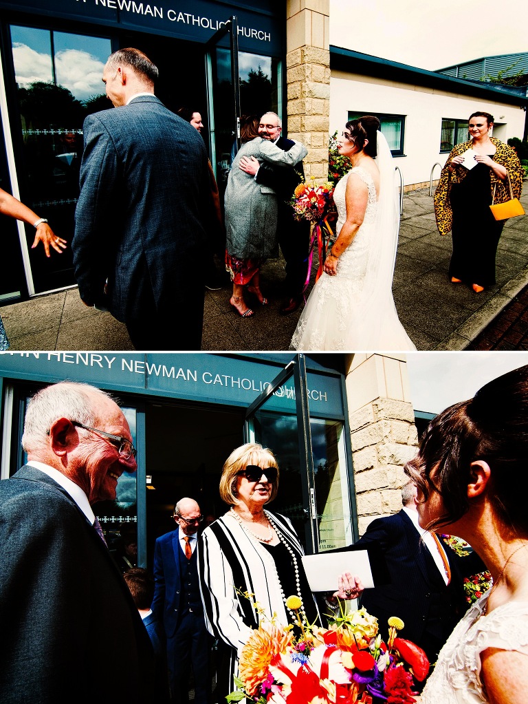 Guests celbrating with bride and groom outside warrington church.