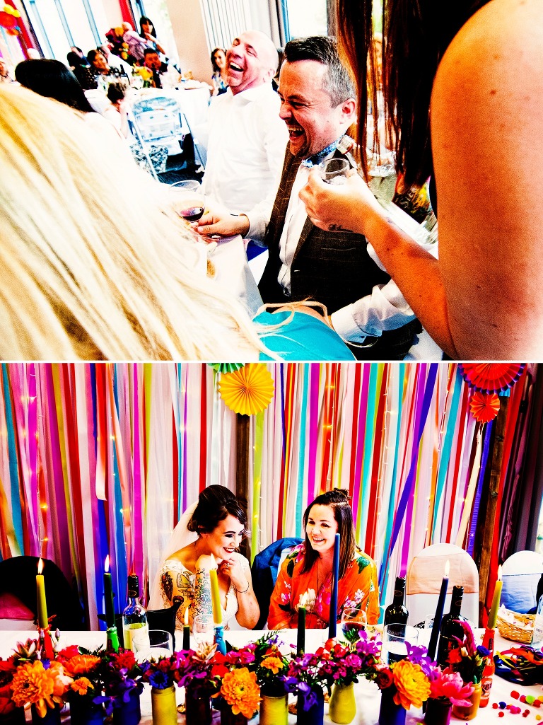 Bride and guest laughing with a vibrant backdrop at mexican inspired wedding