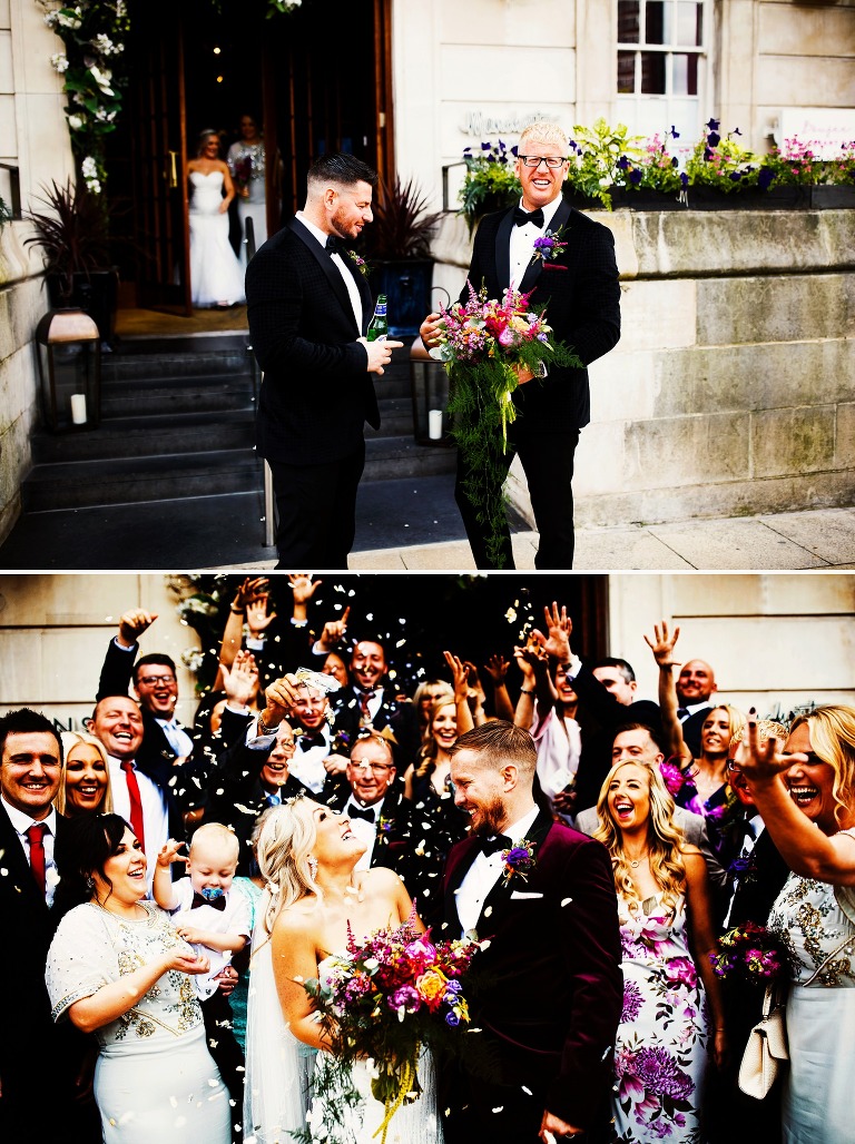Colourful confetti photo with bride, groom and guests outside Manchester Hall.