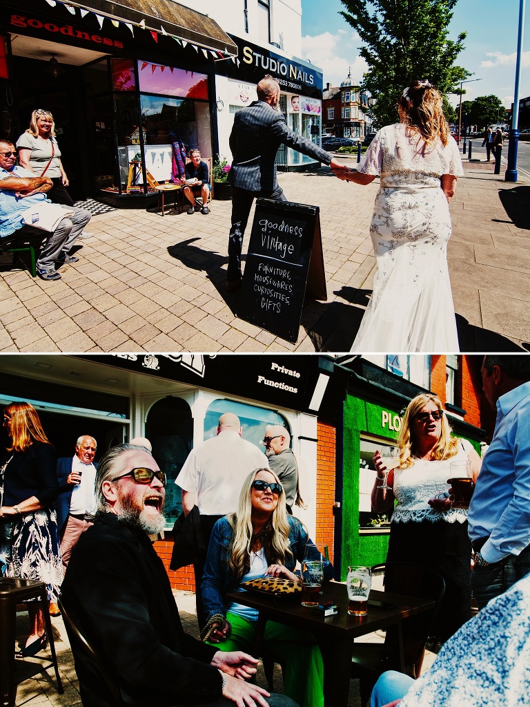 Portrait of bride and groom walking past goodness vintage in St Annes.