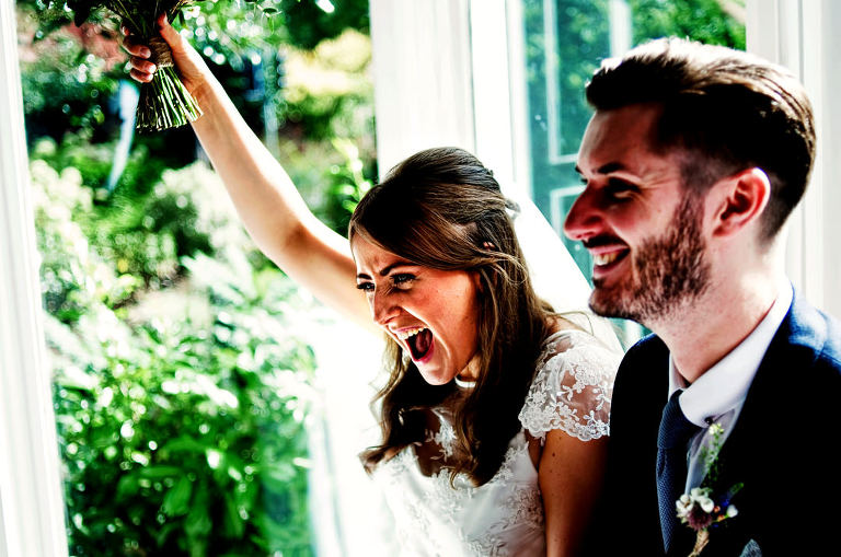 bride and groom celebrating at Didsbury House Hotel