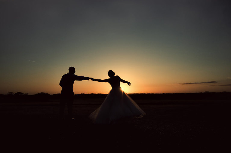 beautiful sunset photograph with bride and groom at Beeston manor in lancashire